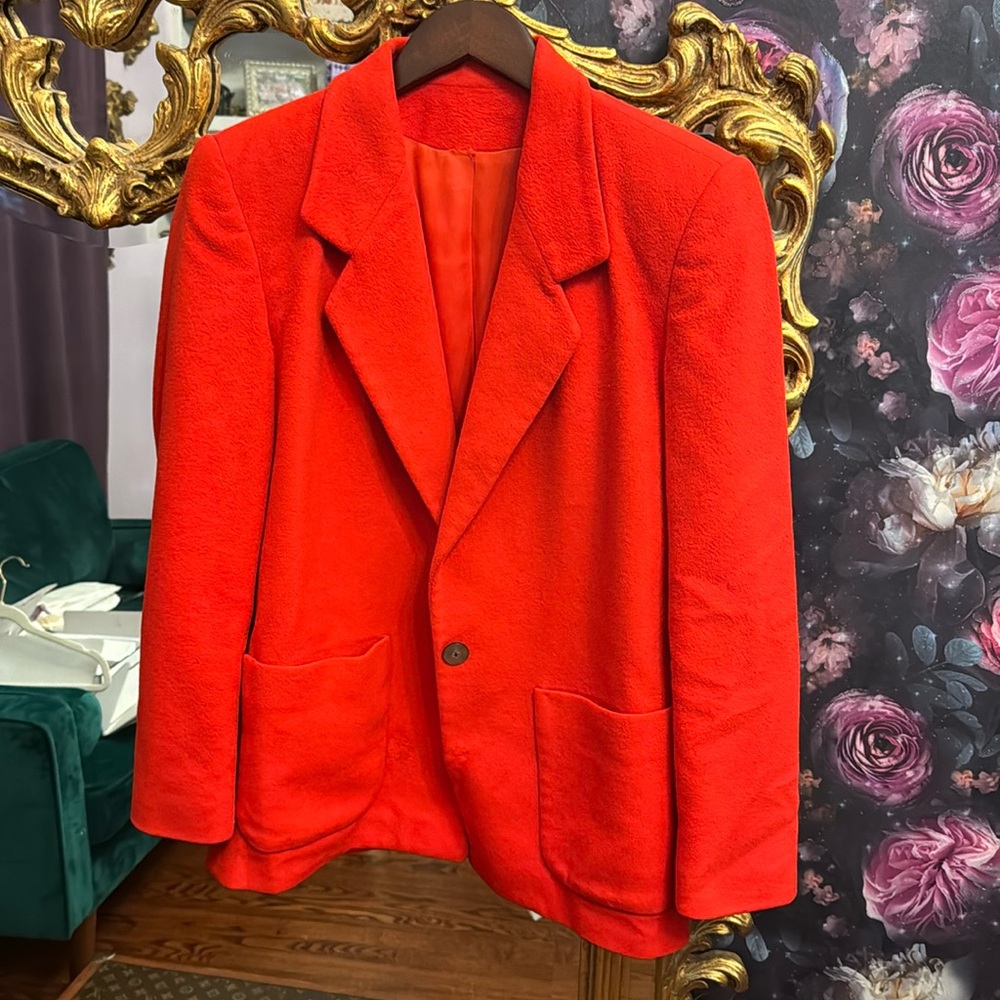 100% cashmere vintage jacket. A little bit of a deeper red than on the pictures.